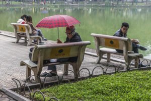 Reading by the lake in Hanoi